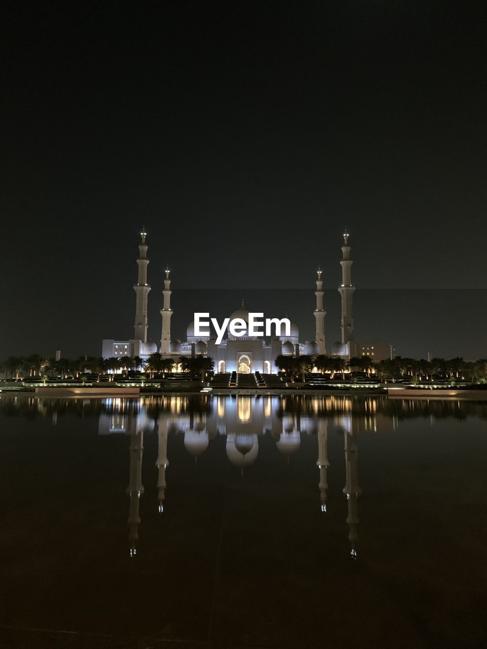 REFLECTION OF ILLUMINATED BUILDINGS IN LAKE