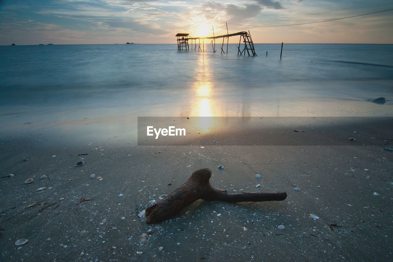 Scenic view of sea against sky at sunset