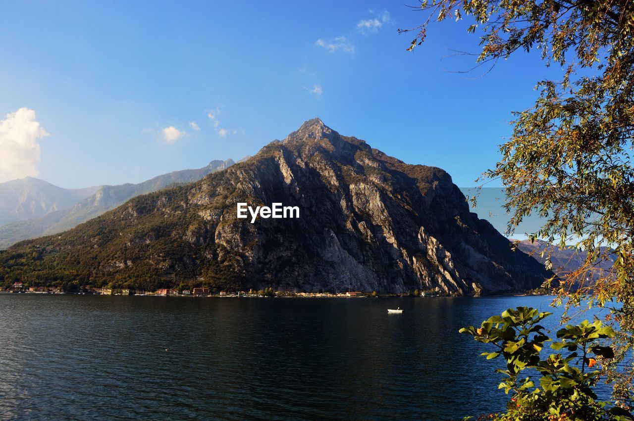 Scenic view of lake and mountains against sky