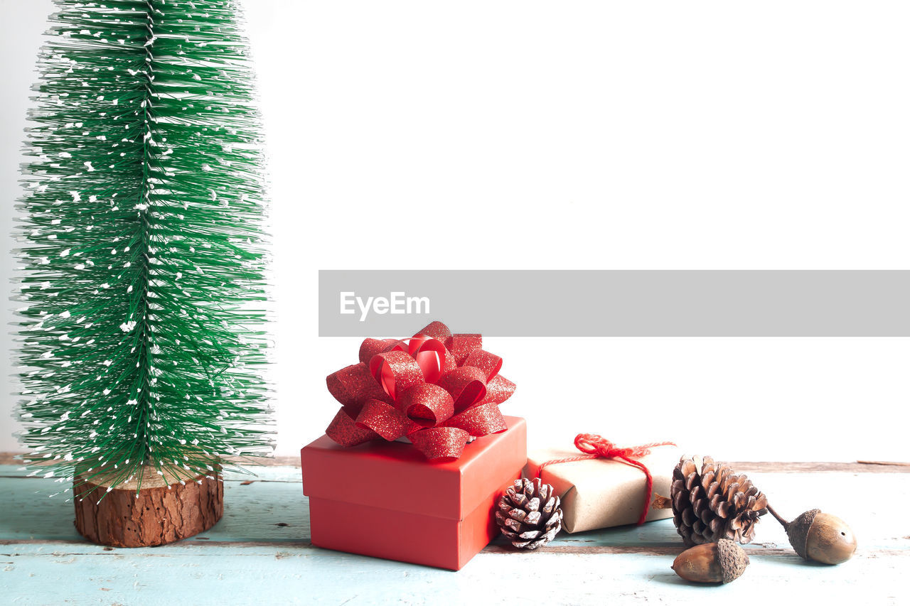 Close-up of christmas decoration and gift box on table