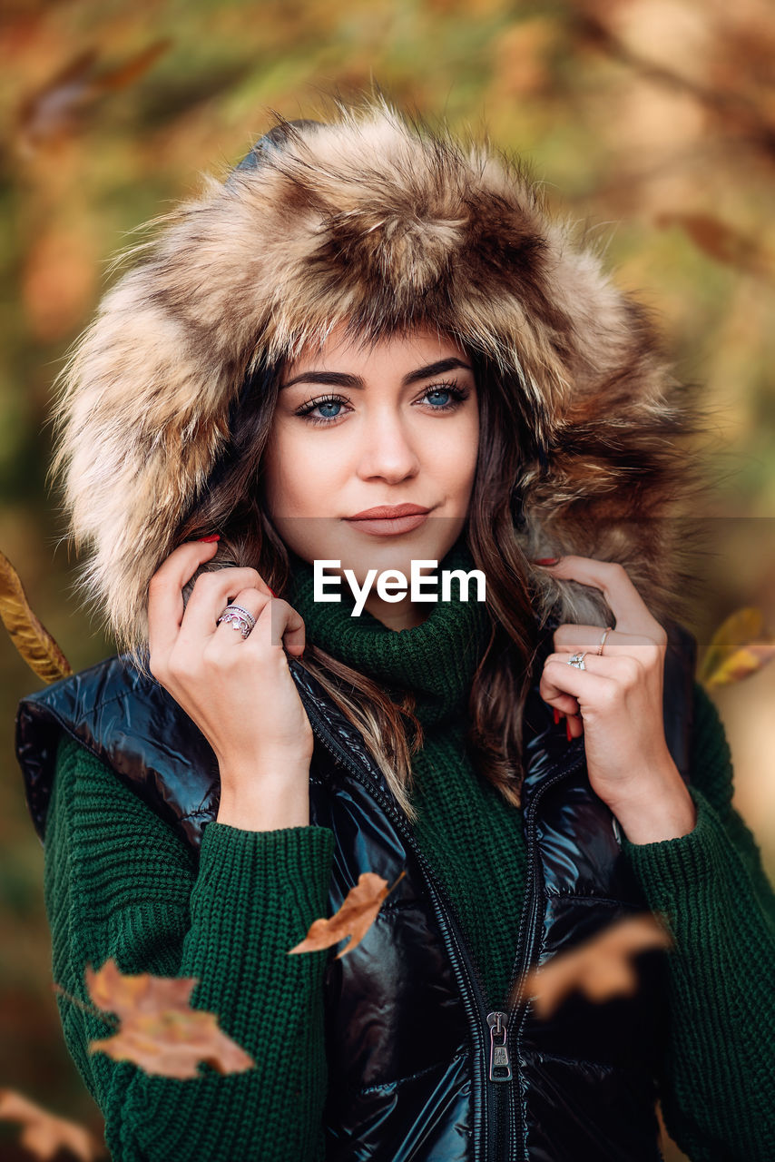 Beautiful young woman wearing winter coat