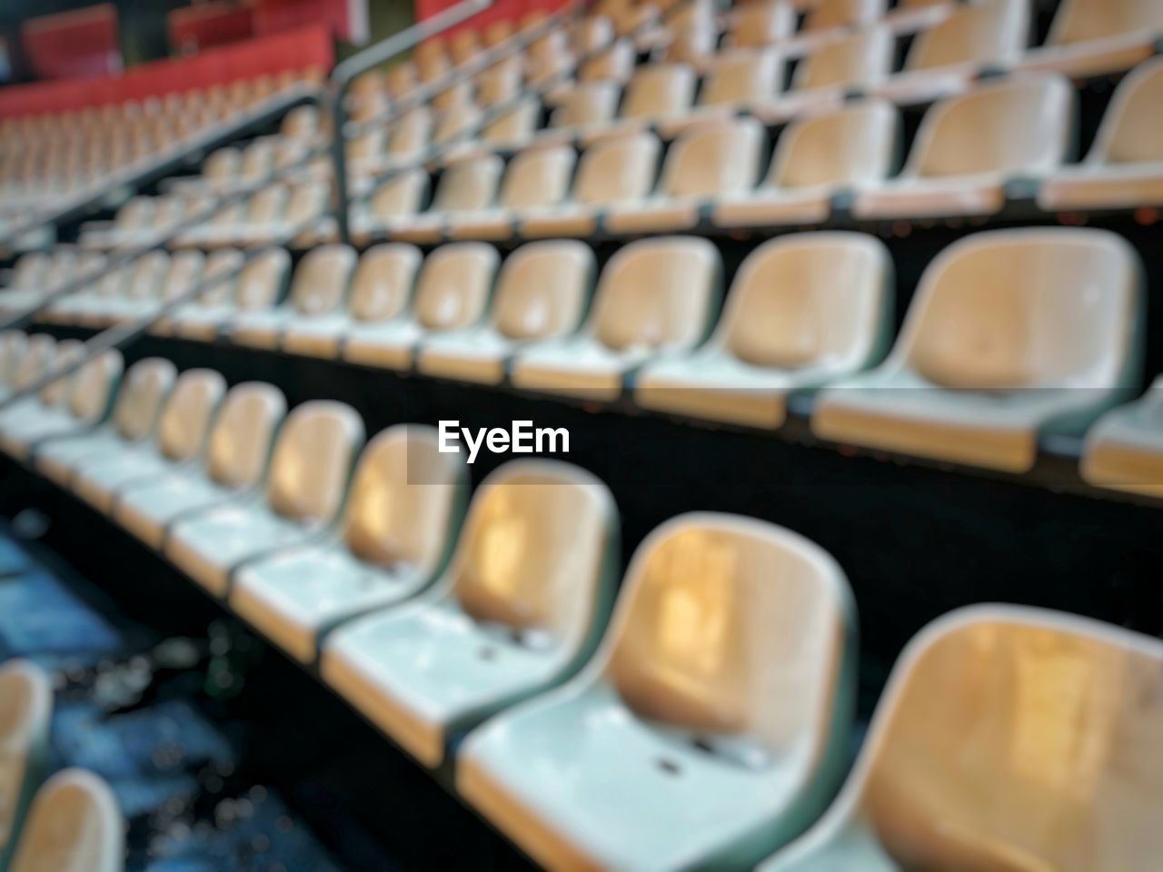Defocused image of empty chairs in stadium