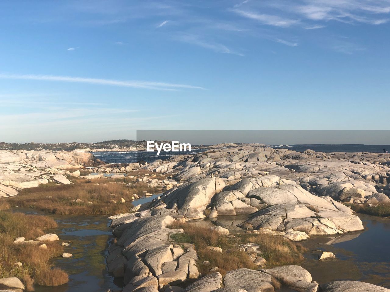 Aerial view of rocks on land against sky