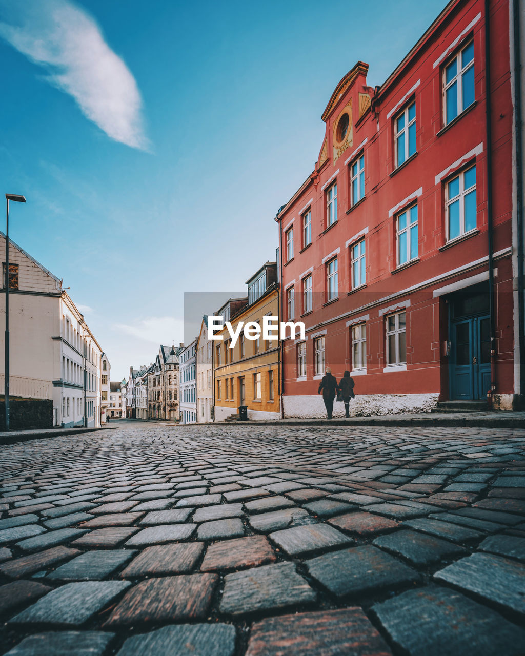 footpath amidst buildings in city