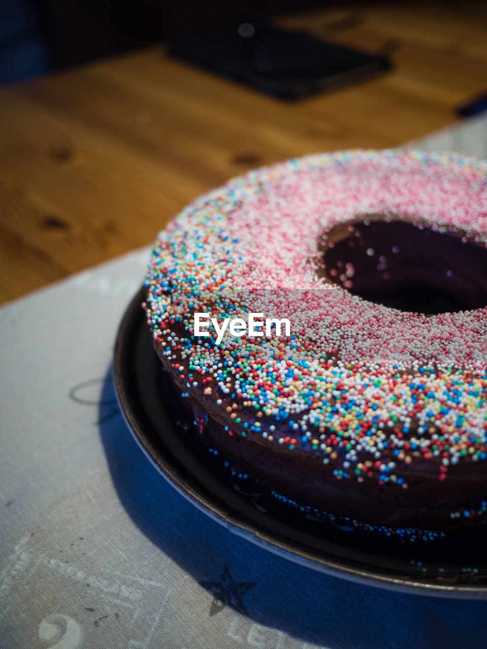 Chocolate cake with sprinkles on table