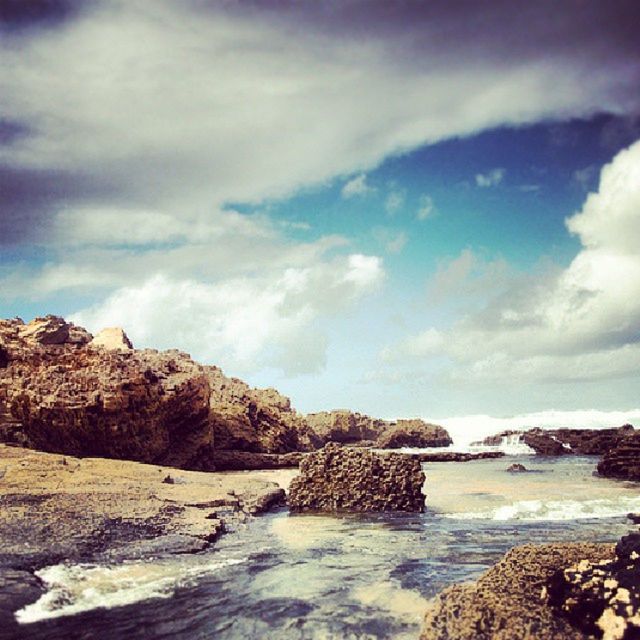SCENIC VIEW OF SEA WITH ROCKS IN BACKGROUND