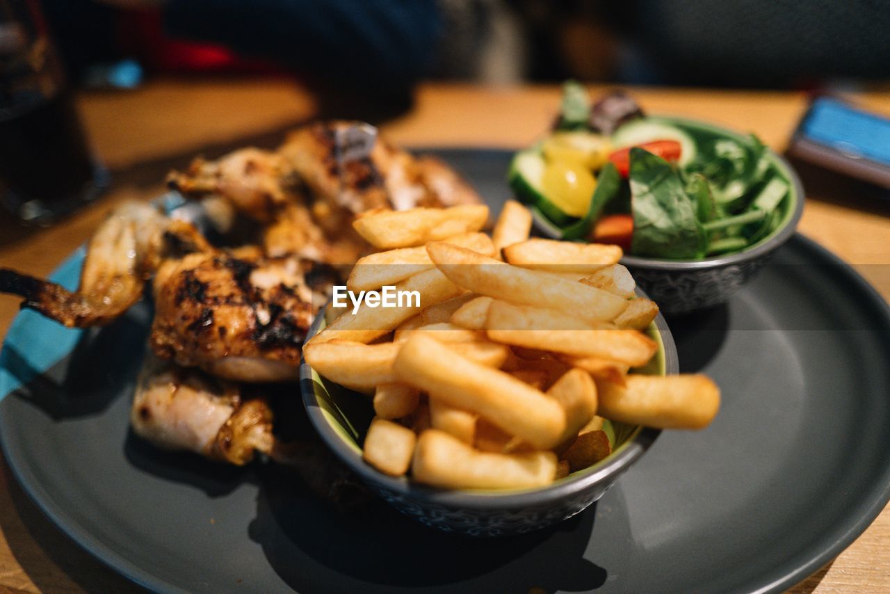 Close-up of fast food in plate on table