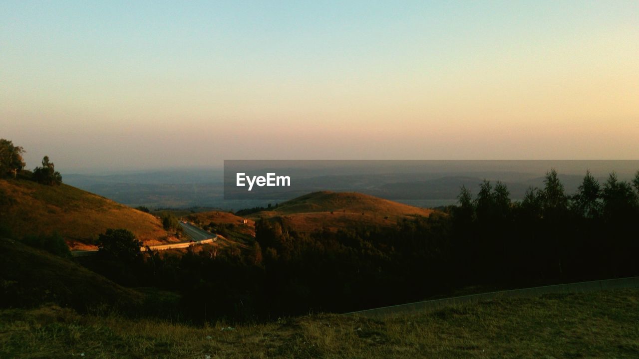 Scenic view of mountains at sunset