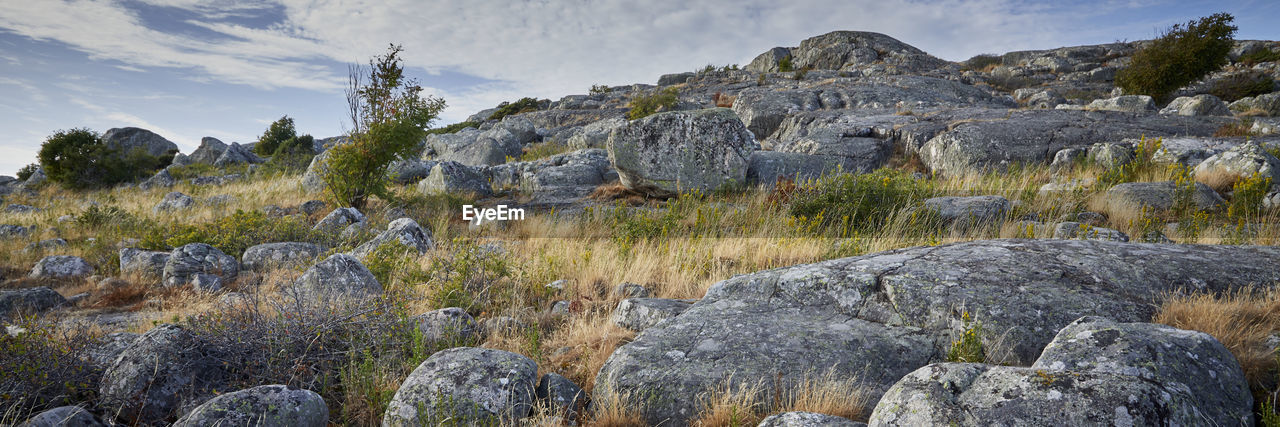 Scenic view of rocks against sky