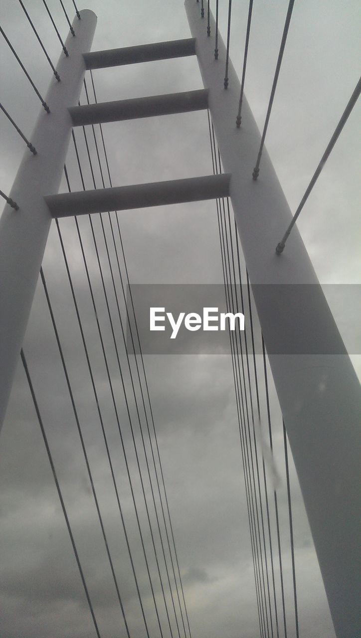 LOW ANGLE VIEW OF POWER LINES AGAINST SKY