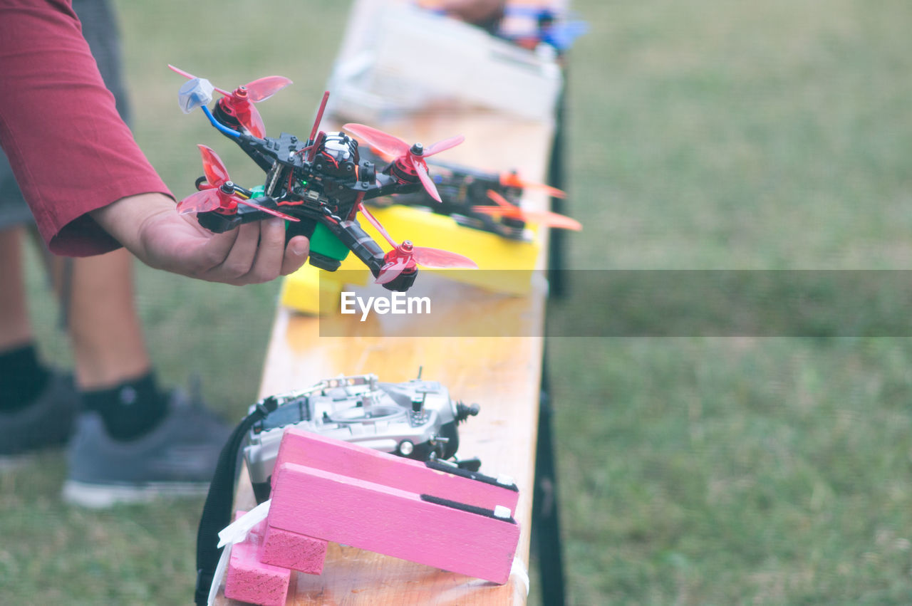 Close-up of hand holding drone