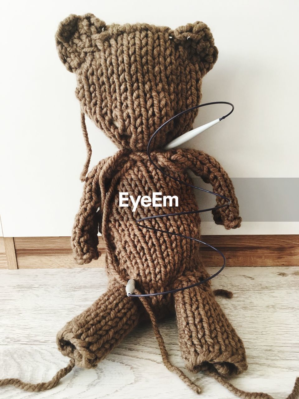 Woolen toy on table at home