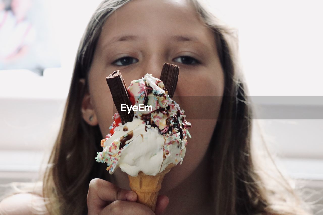 Portrait of woman holding ice cream