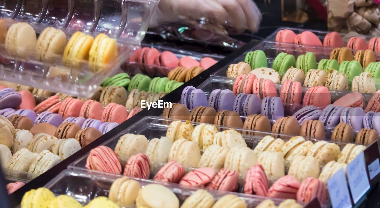 Close-up of colorful macaroons for sale in market
