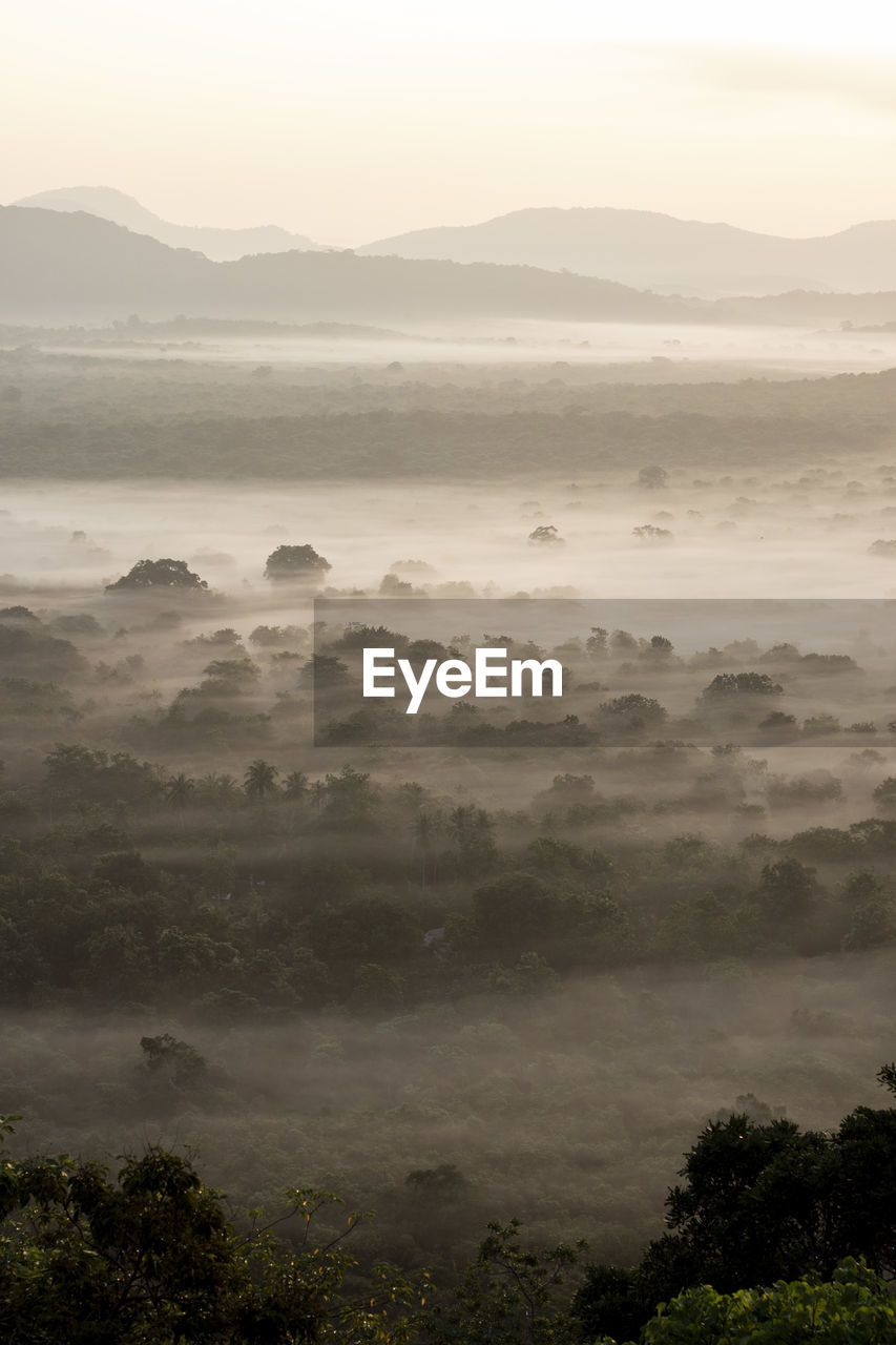 Scenic view of mountains against sky during sunset