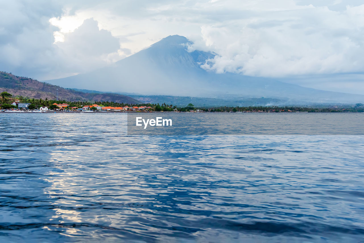 Beautiful balinese seascape view on volcano agung in amed village. bali, indonesia