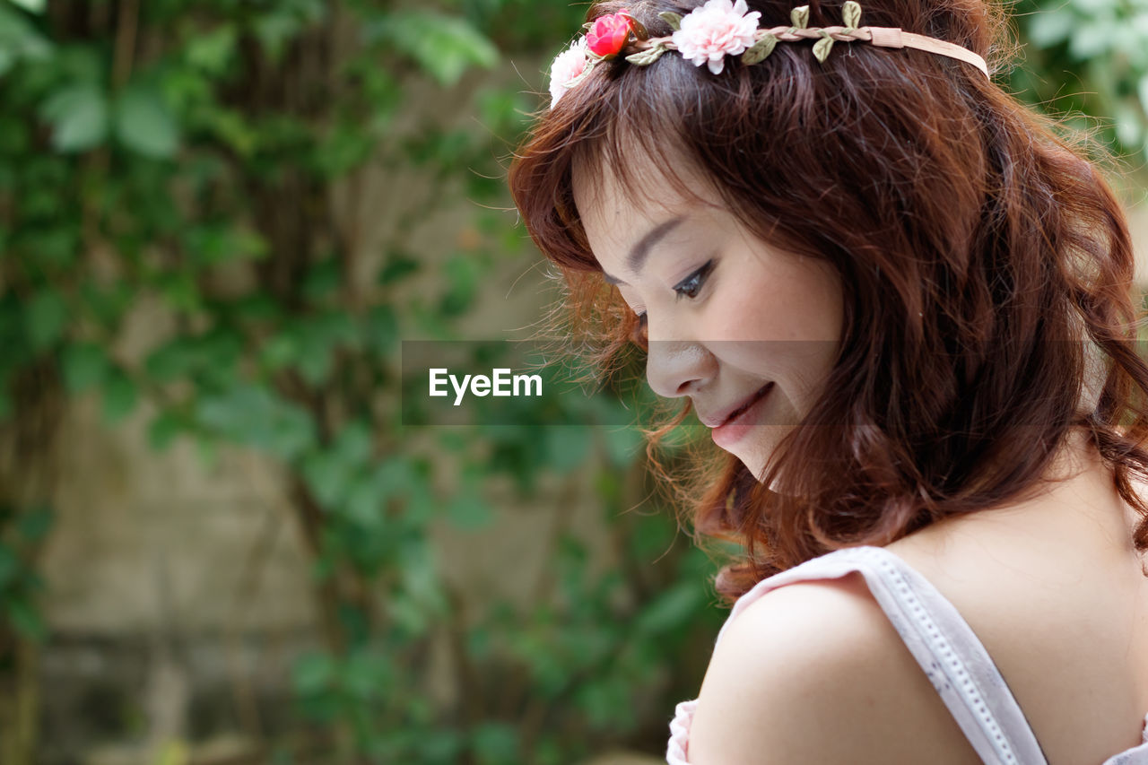 Close-up of young woman standing outdoors