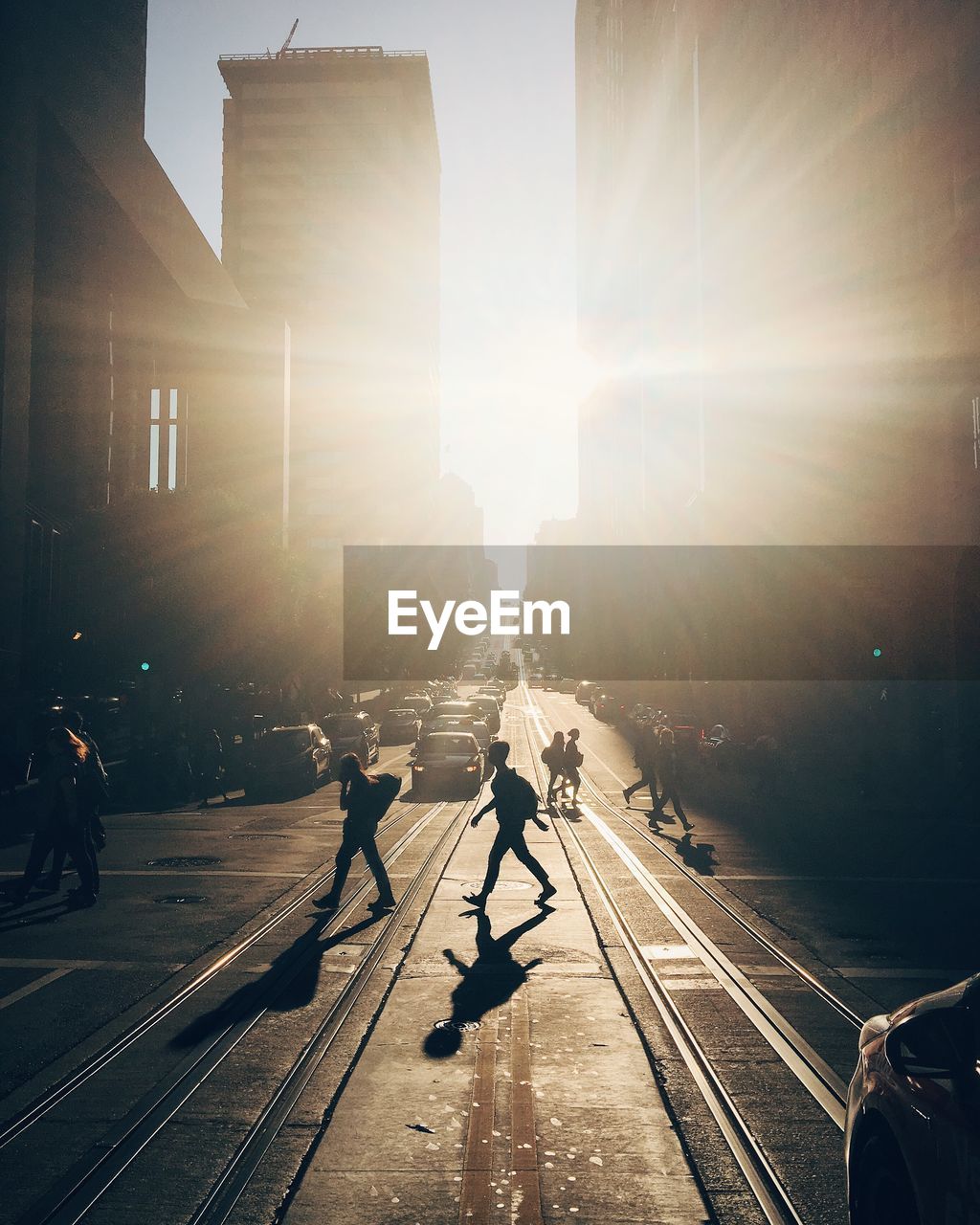 People on city street during sunset