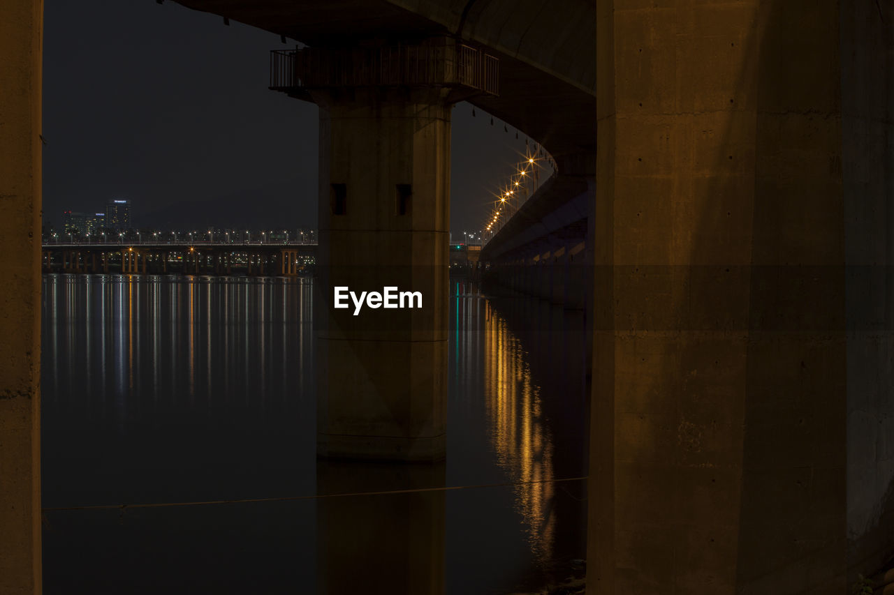 Underneath view of illuminated bridge over river han at night