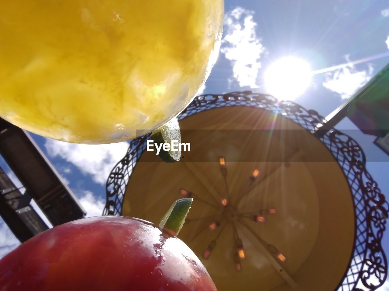 Close-up of cocktails against parasol