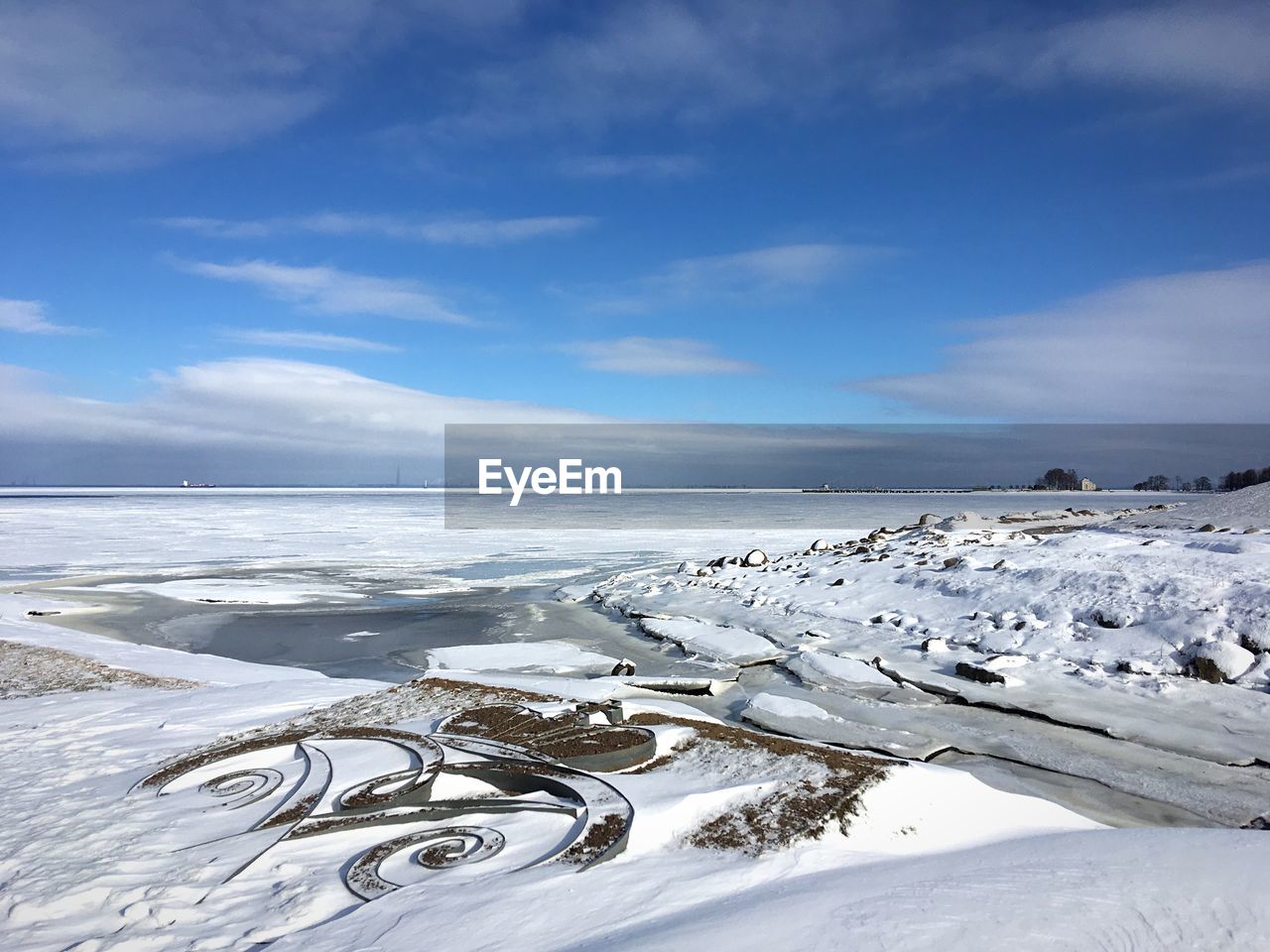 Scenic view of sea against sky during winter