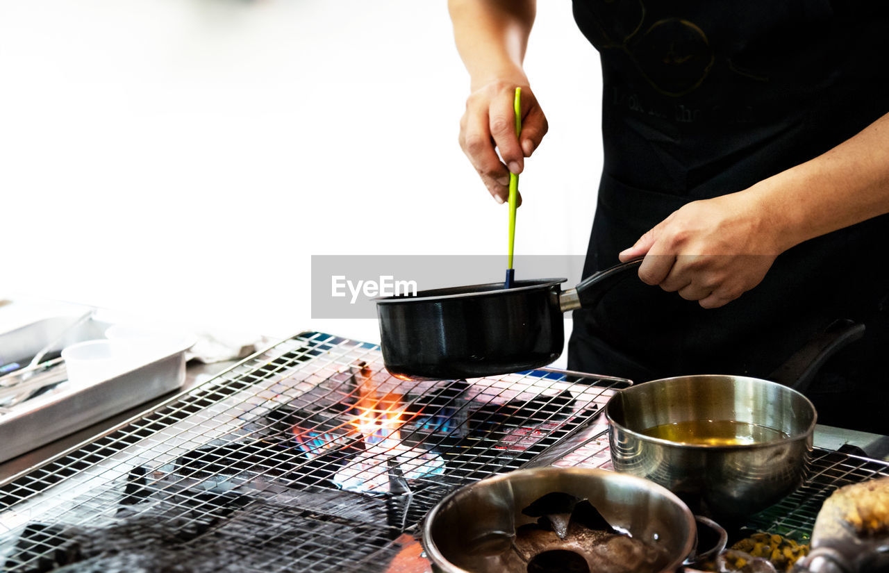 midsection of man preparing food at table