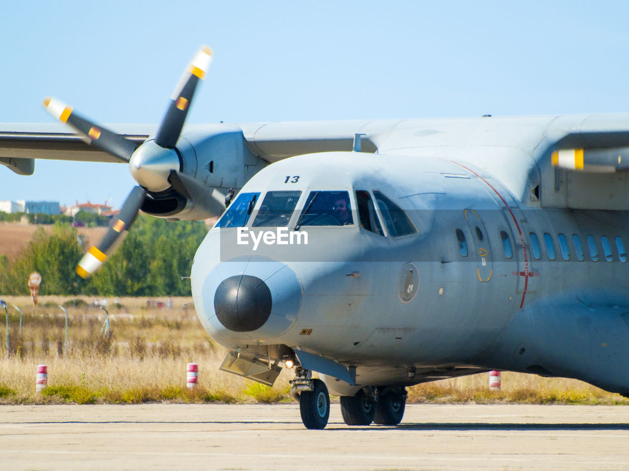 AIRPLANE ON AIRPORT RUNWAY