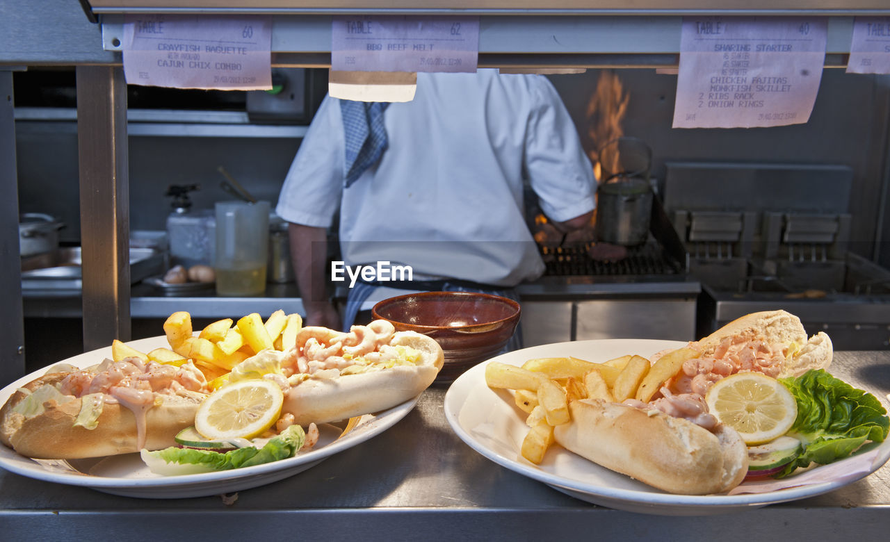 Pub food ready to be served in commercial kitchen at british pub