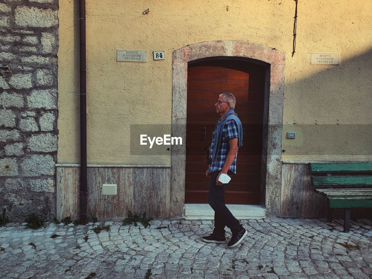 Full length of man standing by door