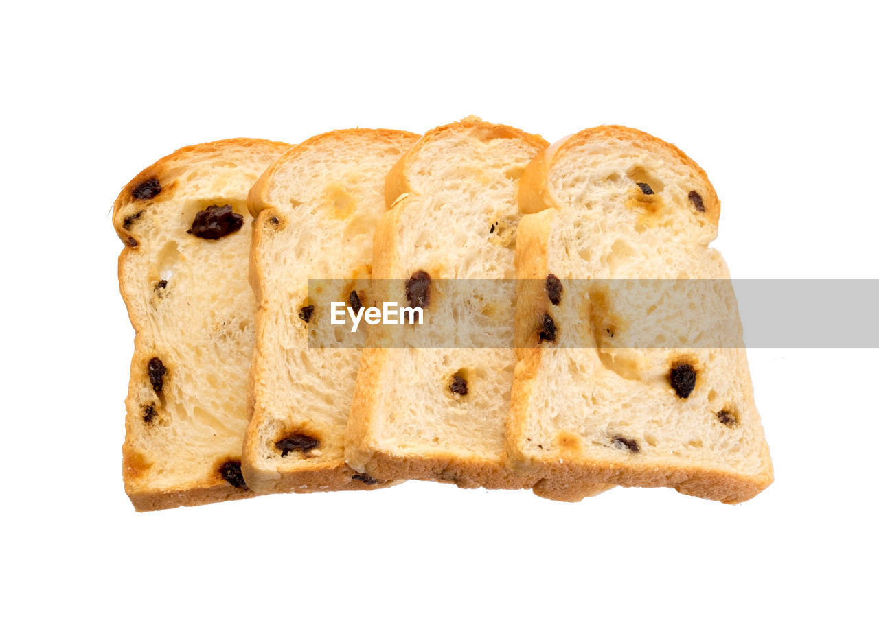 CLOSE-UP OF BREAD AGAINST GRAY BACKGROUND