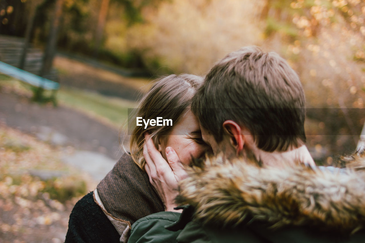 Couple kissing in park