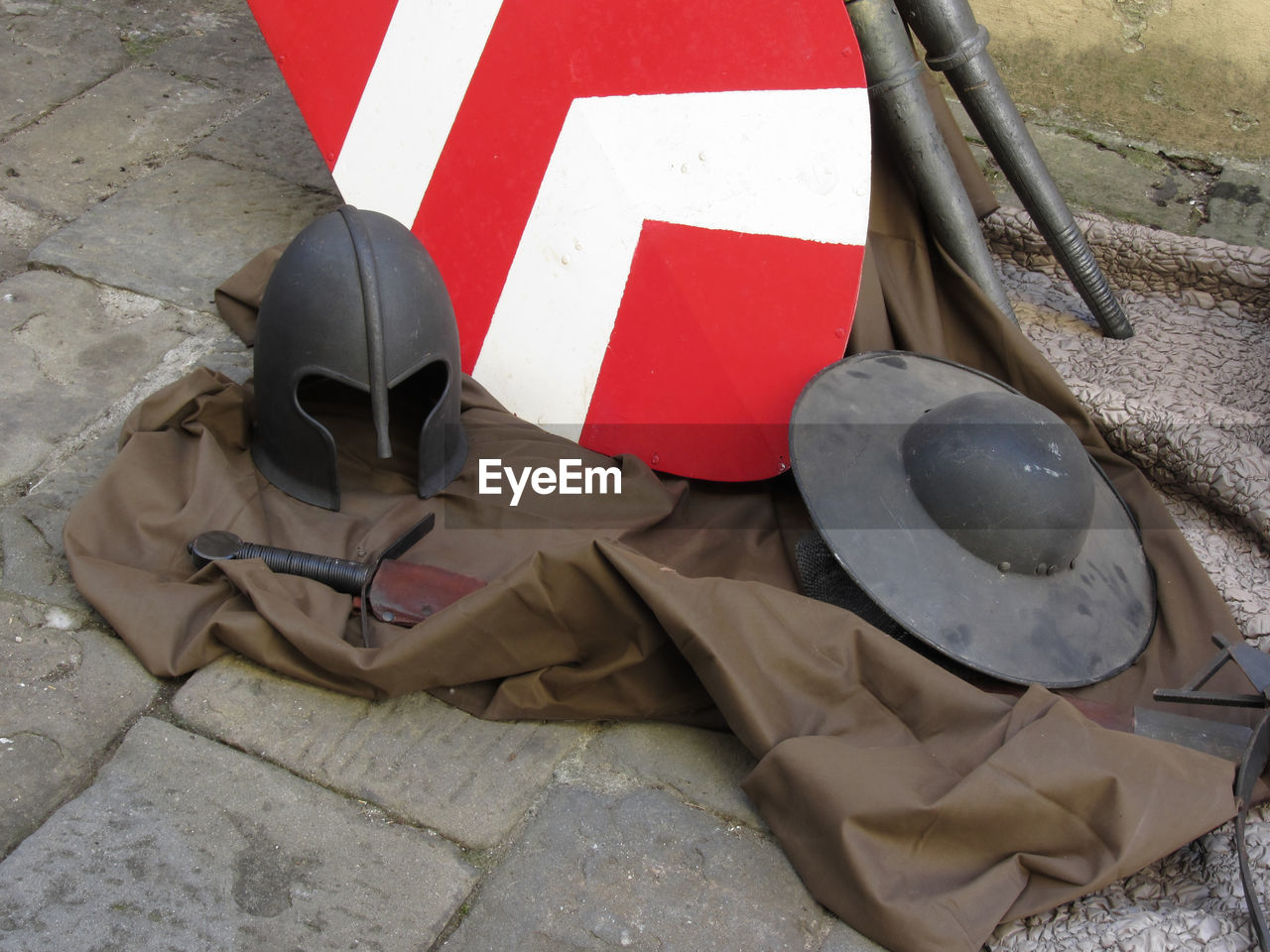 HIGH ANGLE VIEW OF RED UMBRELLA ON GROUND