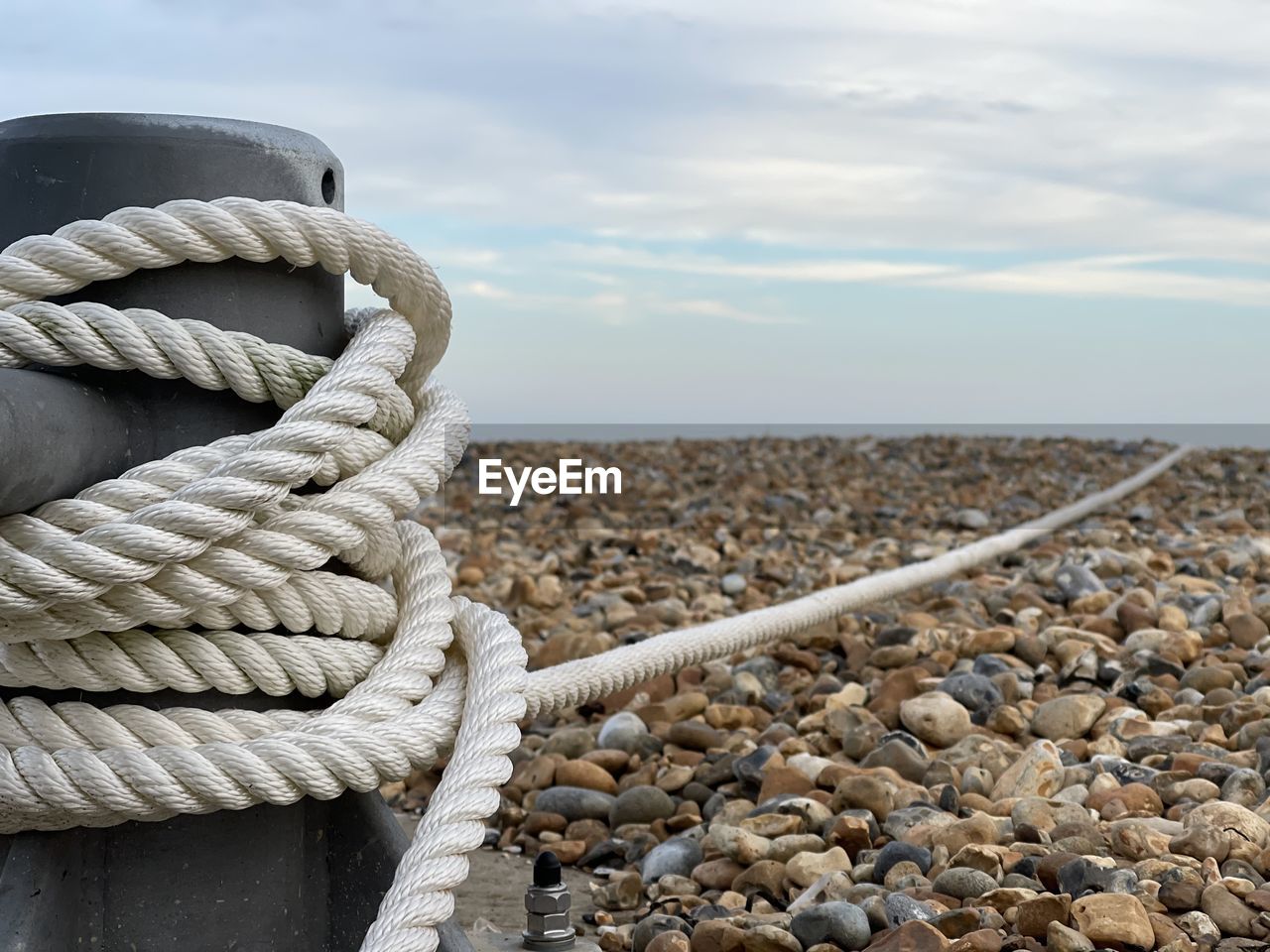 Nautical rope wrapped round steel pillar on the beach in eastbourne