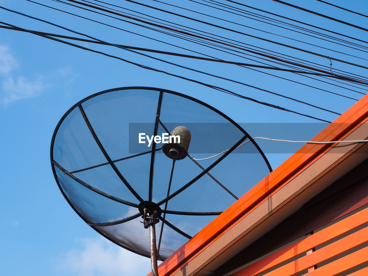 Low angle view of cables against blue sky