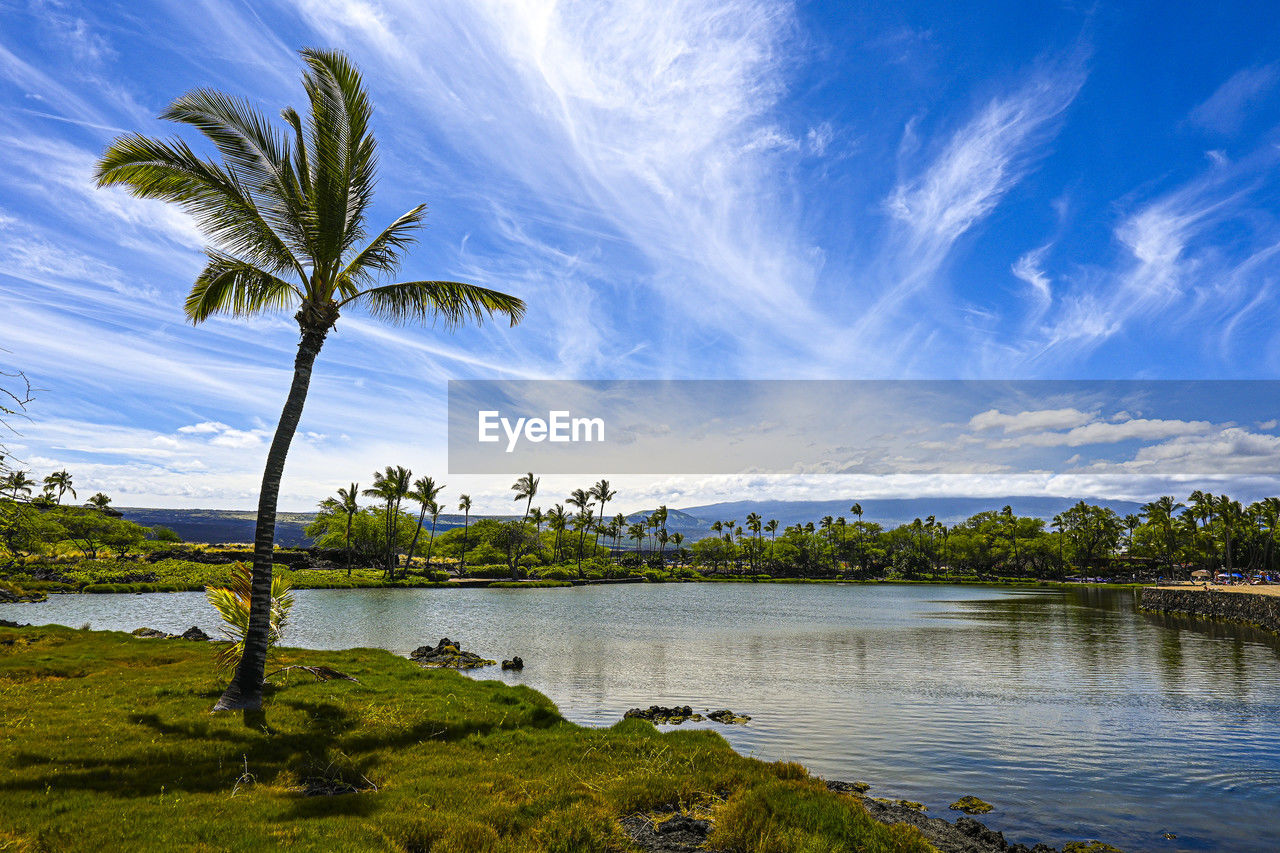 scenic view of lake against cloudy sky