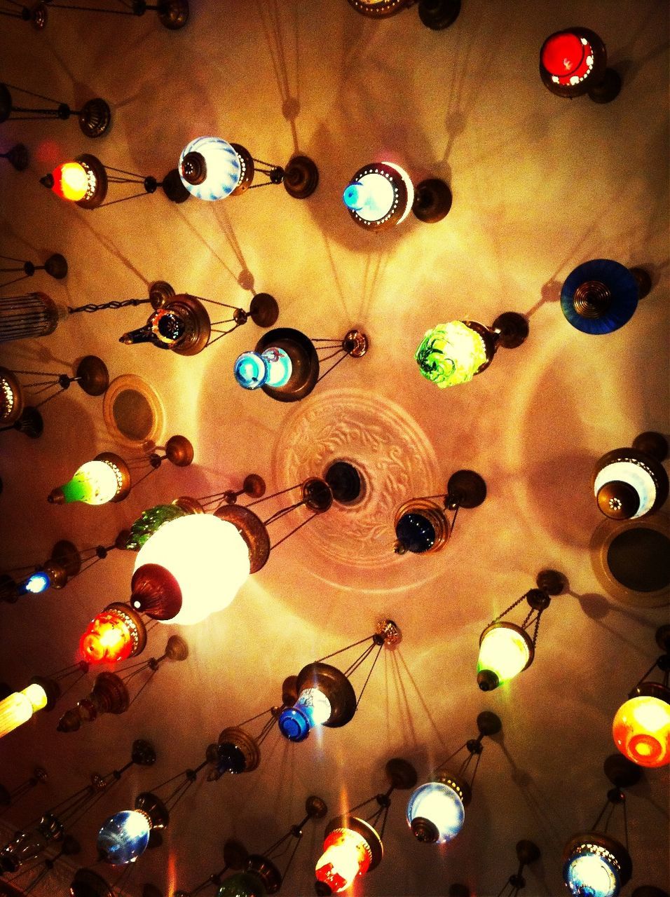 Low angle view of illuminated lanterns hanging by ceiling