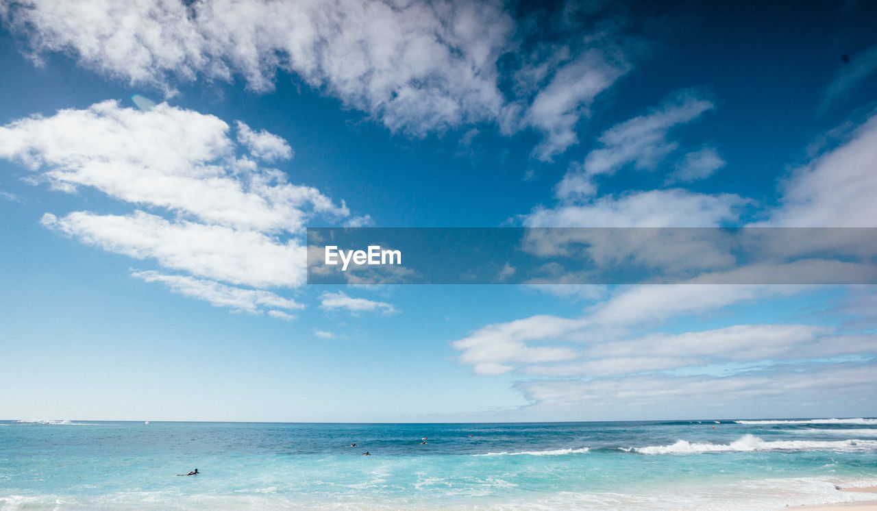 Scenic view of sea against cloudy sky
