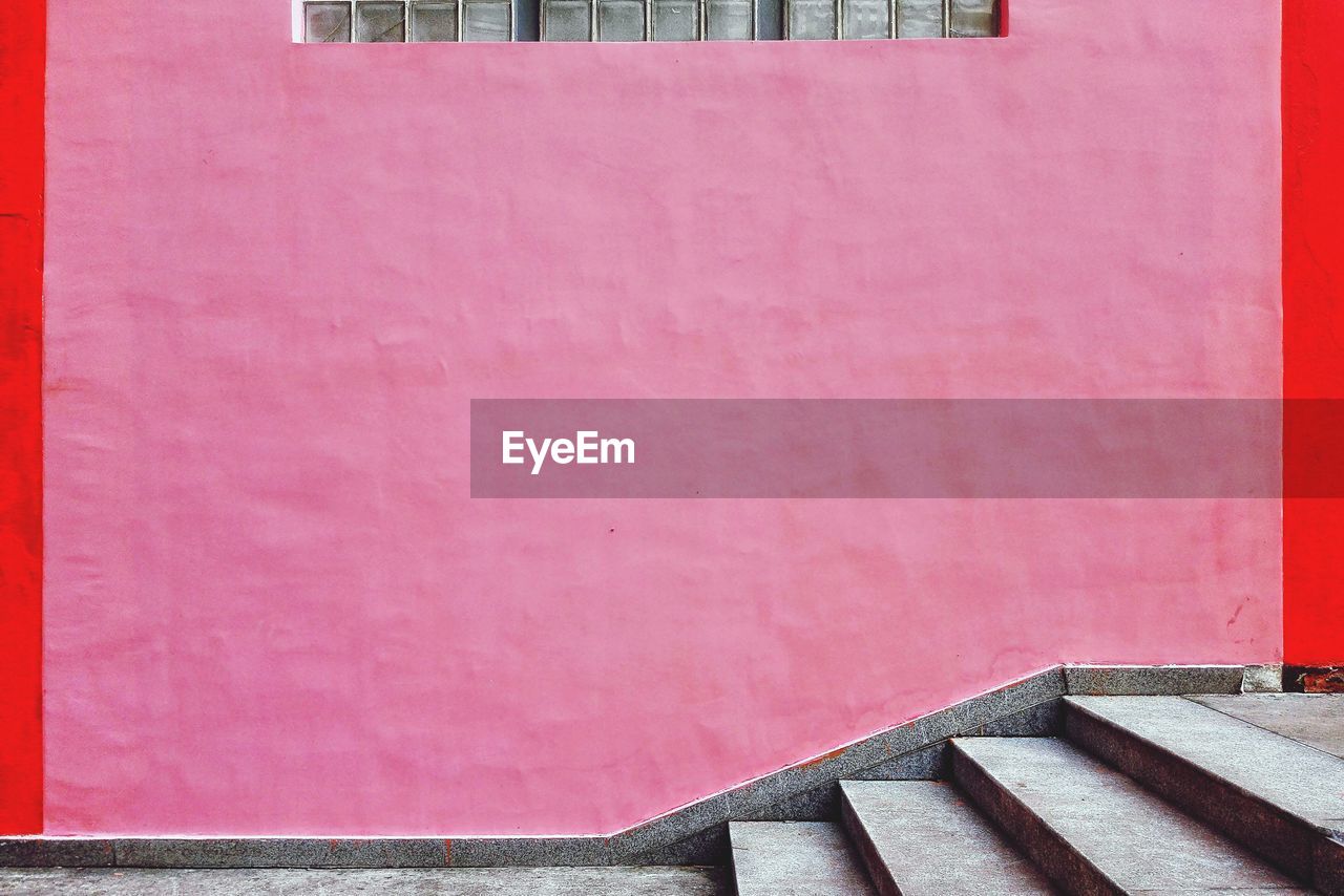 Steps by pink wall