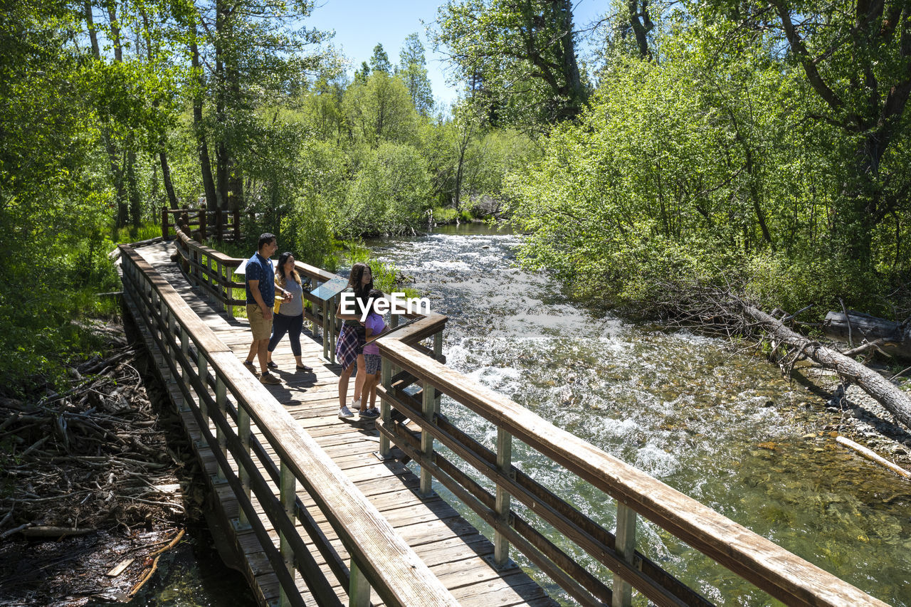 A family walks on a nature trail in south lake tahoe, ca