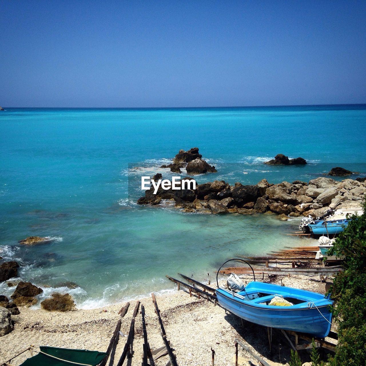 View of rowboats on beach