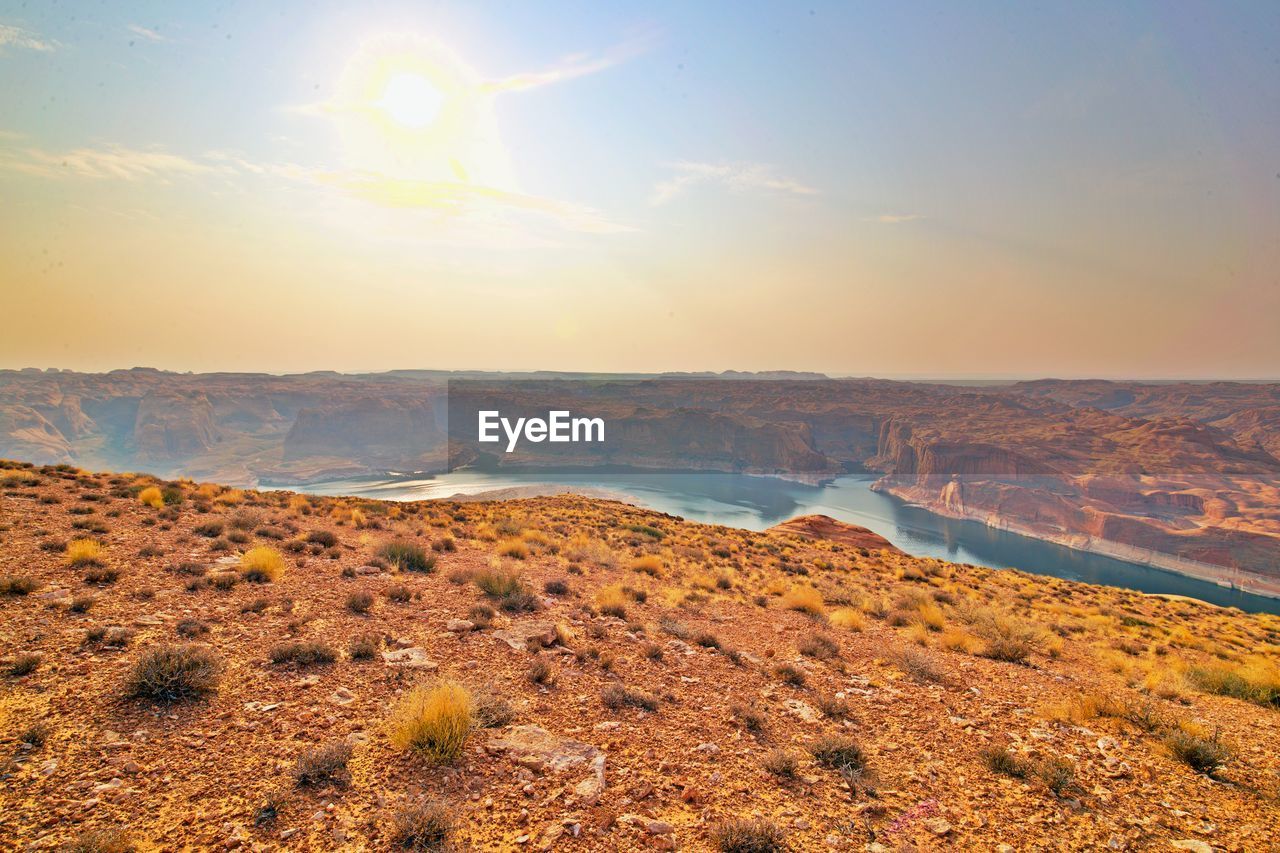 Scenic view of landscape against sky during sunset