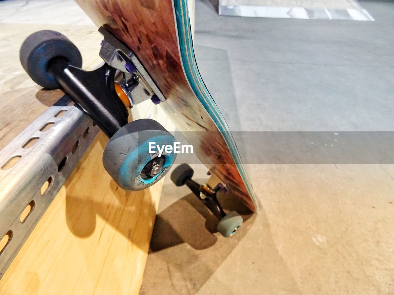 High angle view of skateboard on hardwood floor