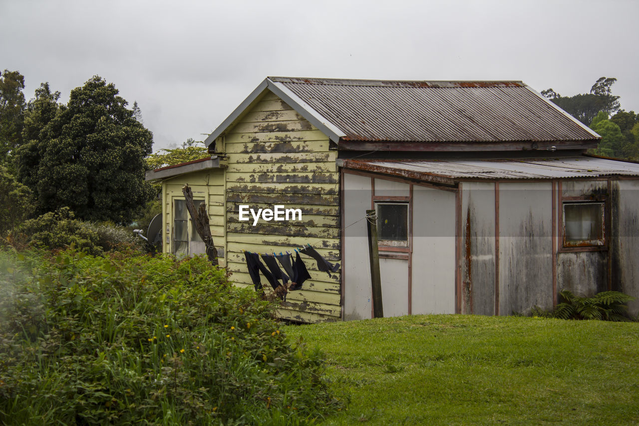 Very old wooden house, with clothes on the clothesline