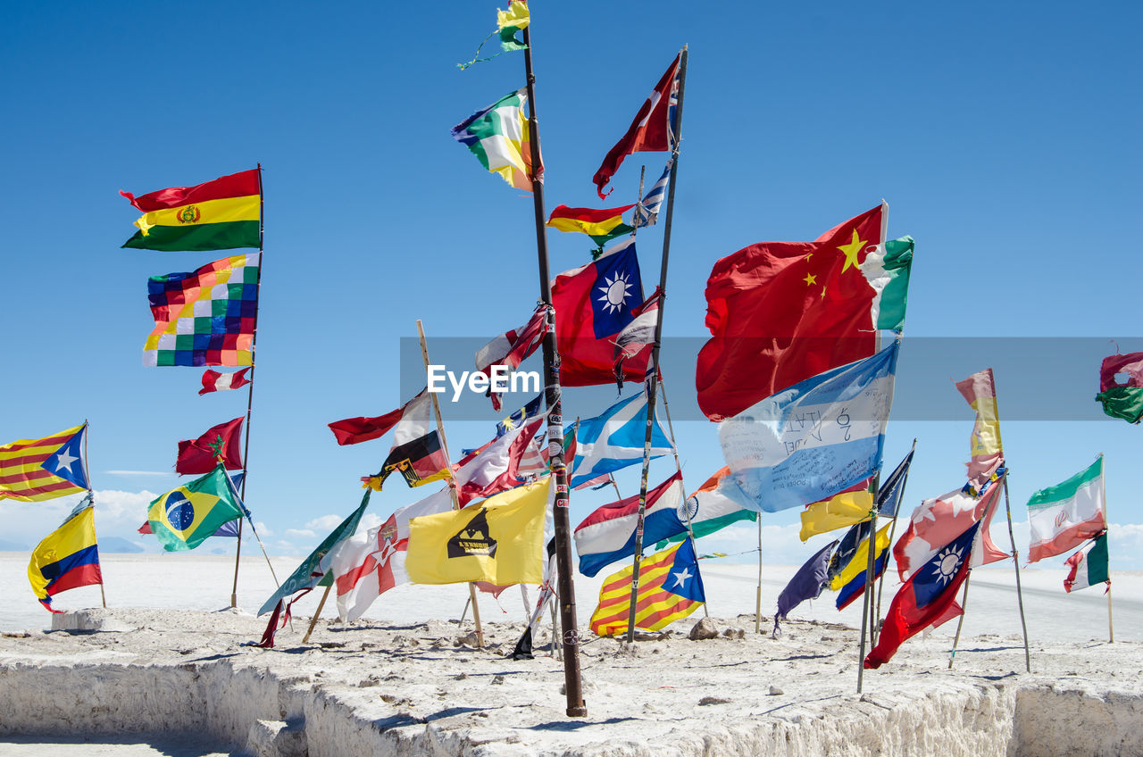 Various flags at salar de uyuni