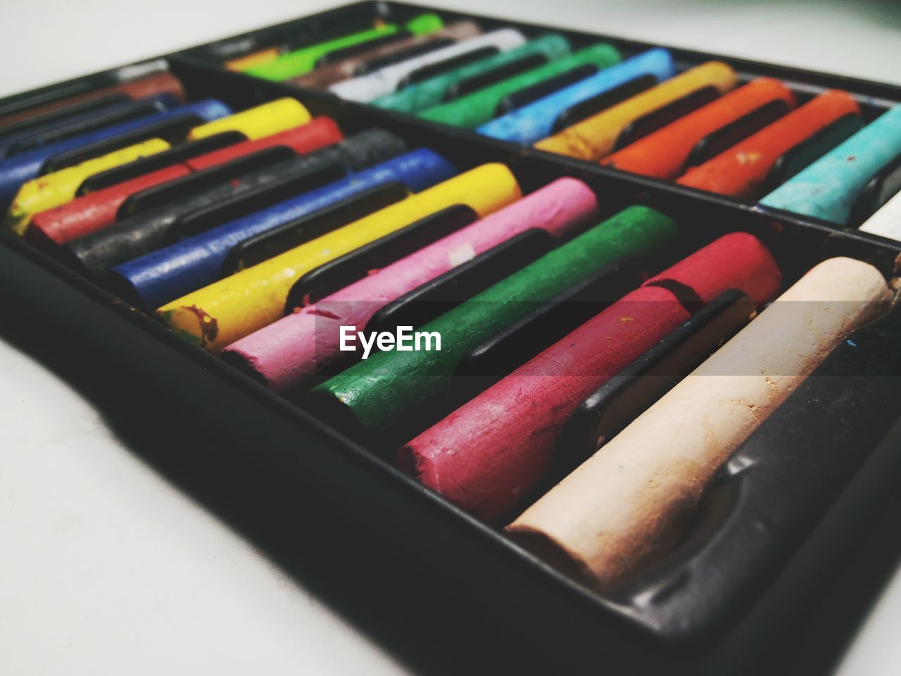 Close-up of colorful crayons in box