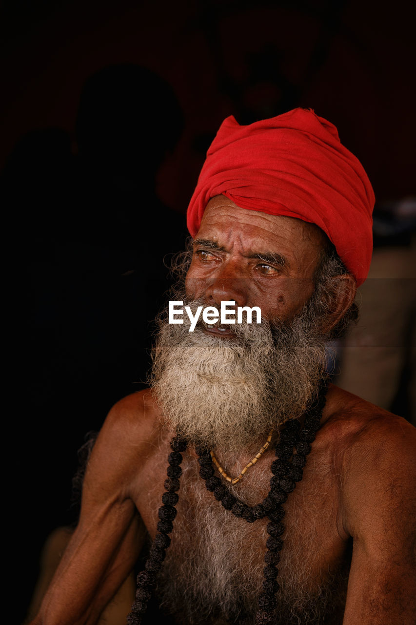 Mature bearded man looking away