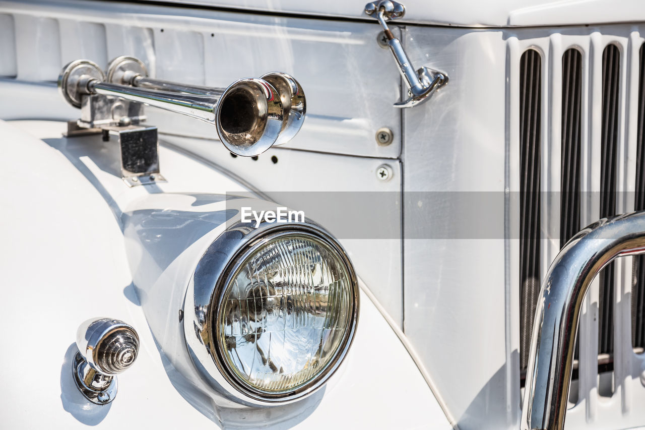 Close-up of white vintage car headlight