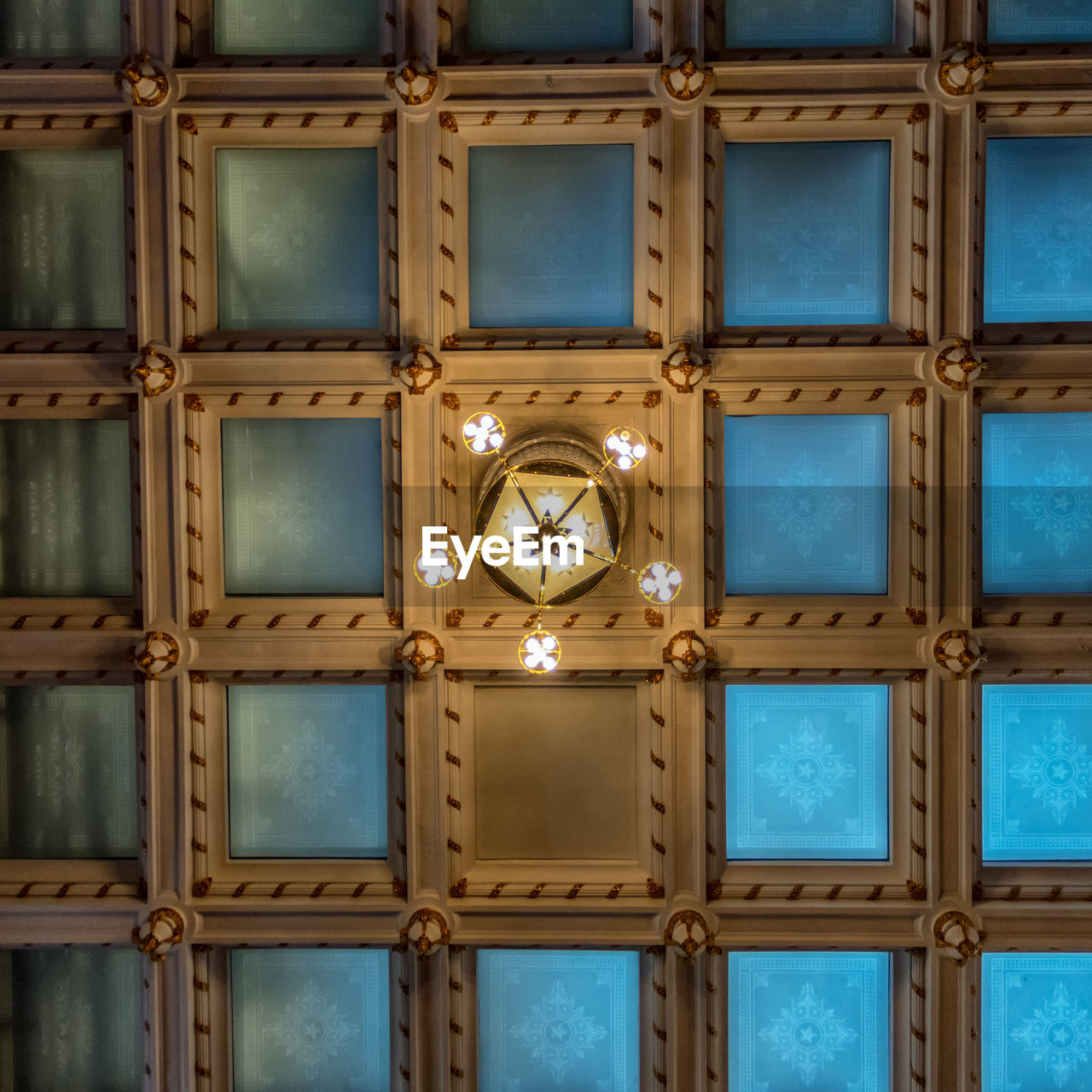 Directly below shot of illuminated chandelier on ceiling