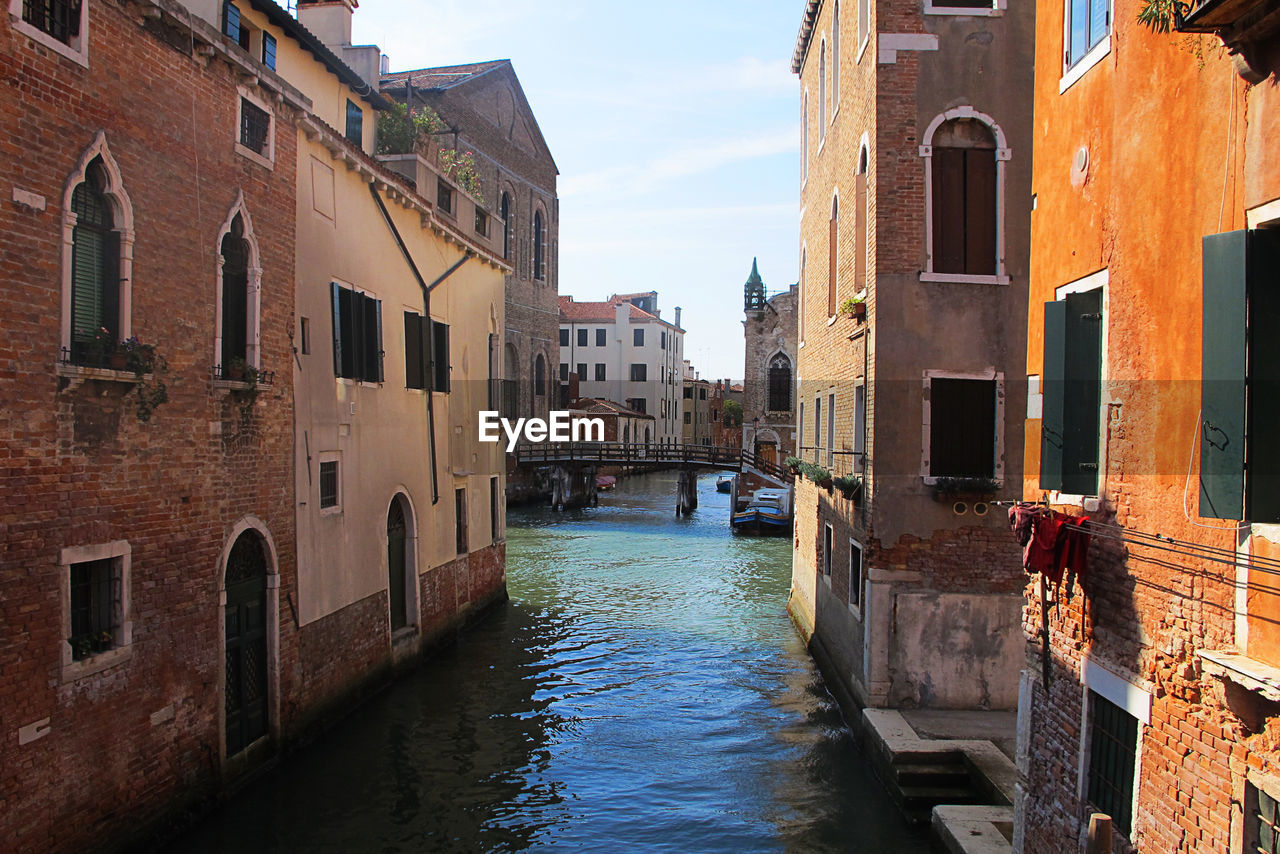 Canal amidst buildings in city