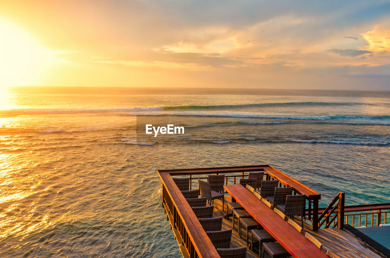 Sunset seascape with water ripple and small waves from the outdoor terrace. bali, single fin